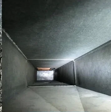 The same air duct showing clean bare sheet metal after a full system cleaning